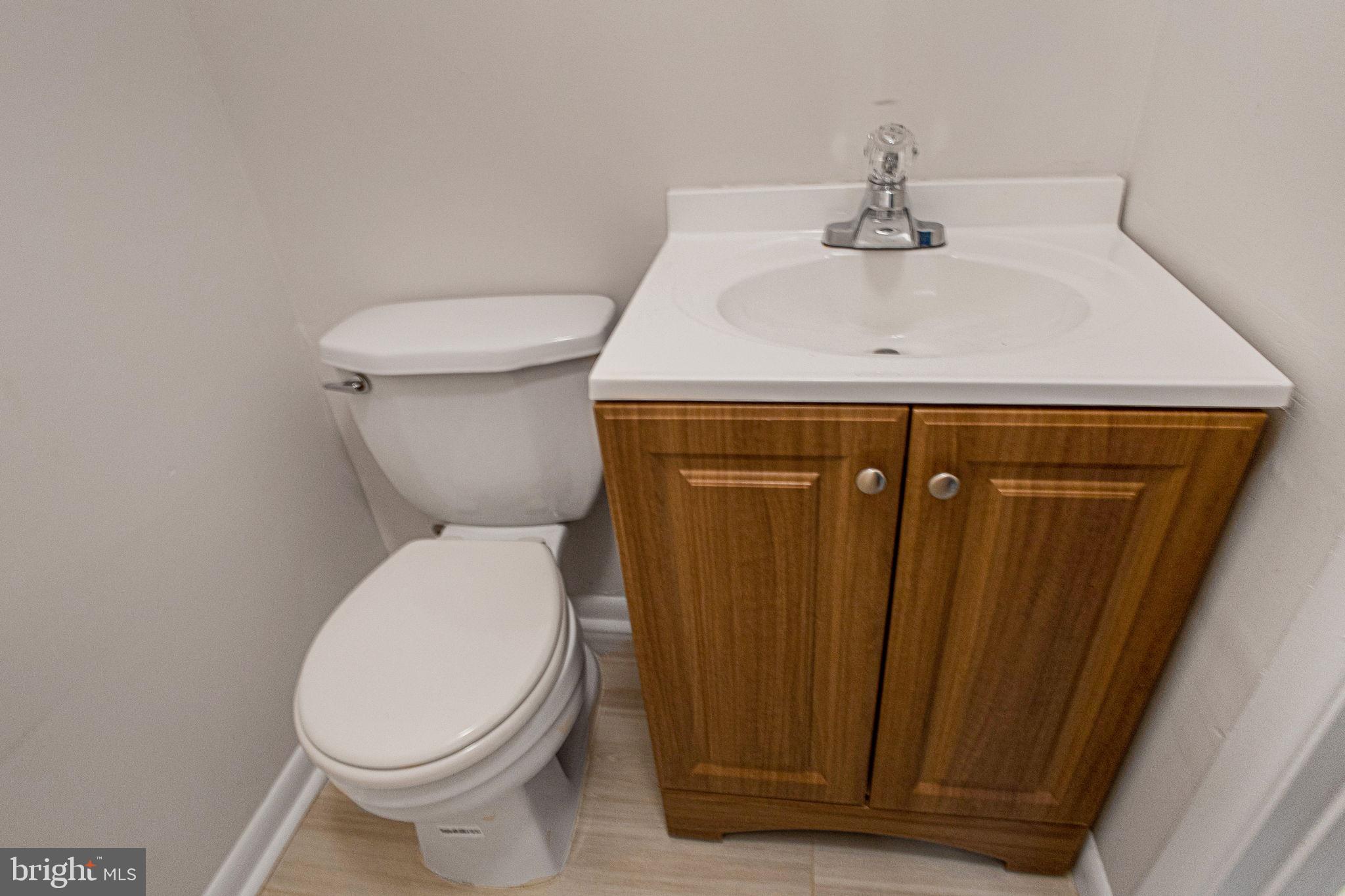 2830 Schoolhouse Circle Silver Spring, MD 20902 - Photo 38 of 58 a bathroom with a sink and a toilet