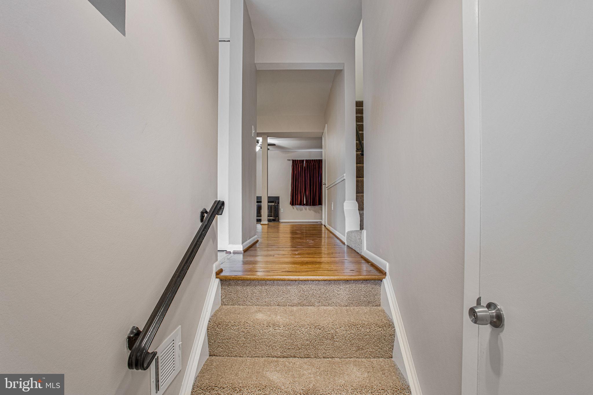 2830 Schoolhouse Circle Silver Spring, MD 20902 - Photo 4 of 58 a view of a hallway with white walls and a window