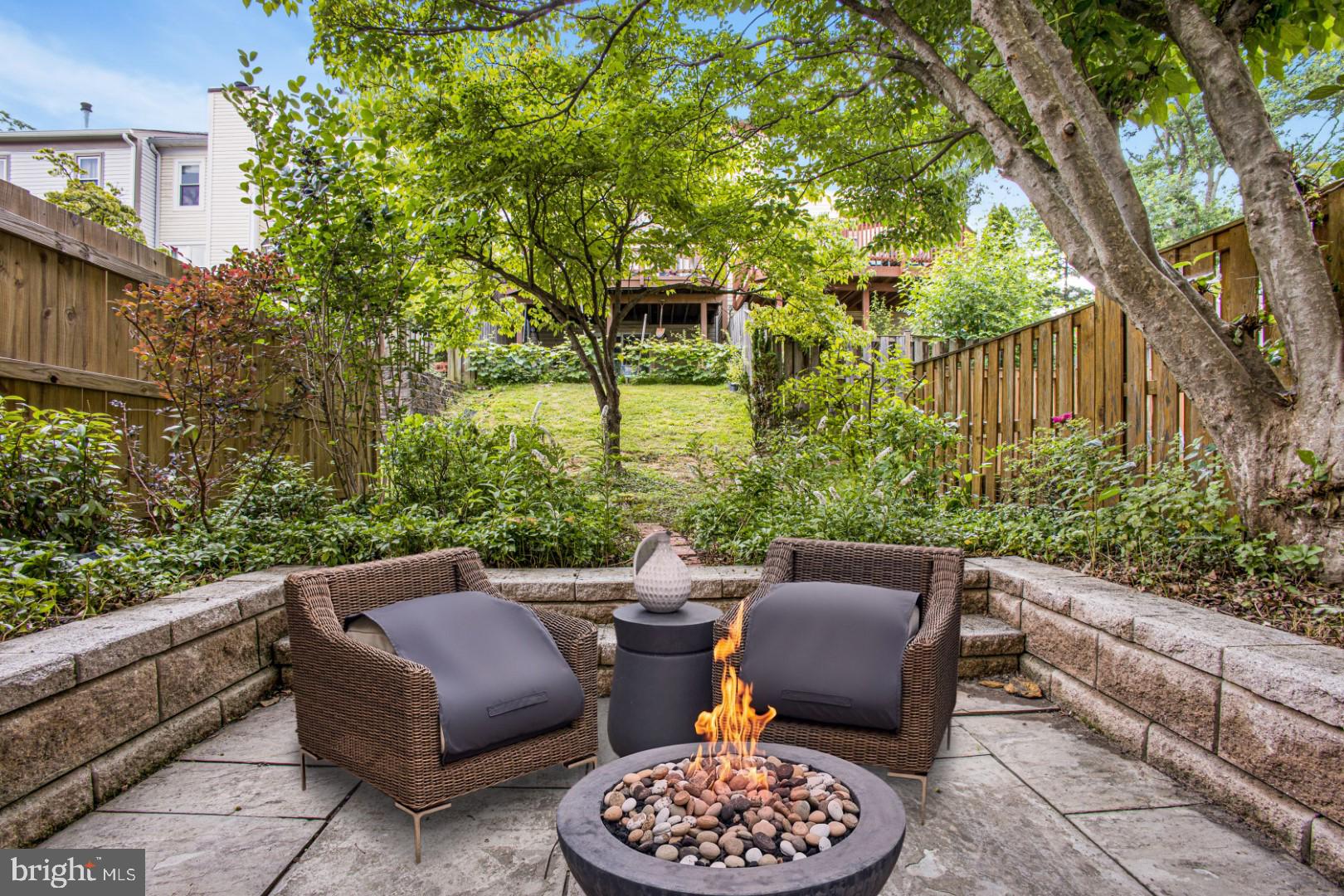 2830 Schoolhouse Circle Silver Spring, MD 20902 - Photo 42 of 58 a view of a patio with couple of chairs in a patio