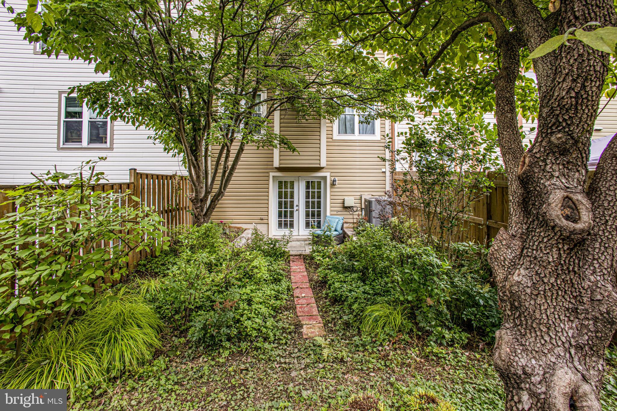 2830 Schoolhouse Circle Silver Spring, MD 20902 - Photo 44 of 58 front view of a house with a yard