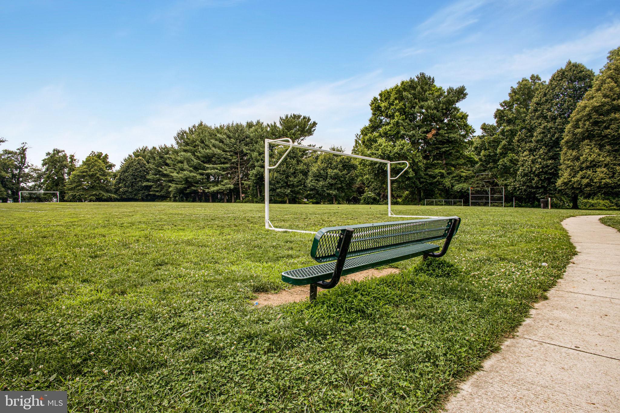 2830 Schoolhouse Circle Silver Spring, MD 20902 - Photo 53 of 58 a bench sitting in the middle of a park
