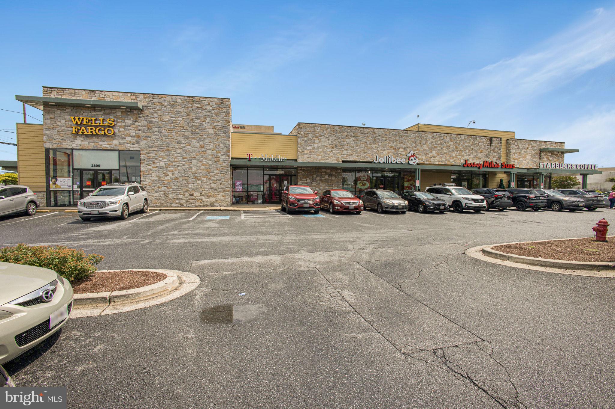 2830 Schoolhouse Circle Silver Spring, MD 20902 - Photo 58 of 58 a view of a cars park in front of a building