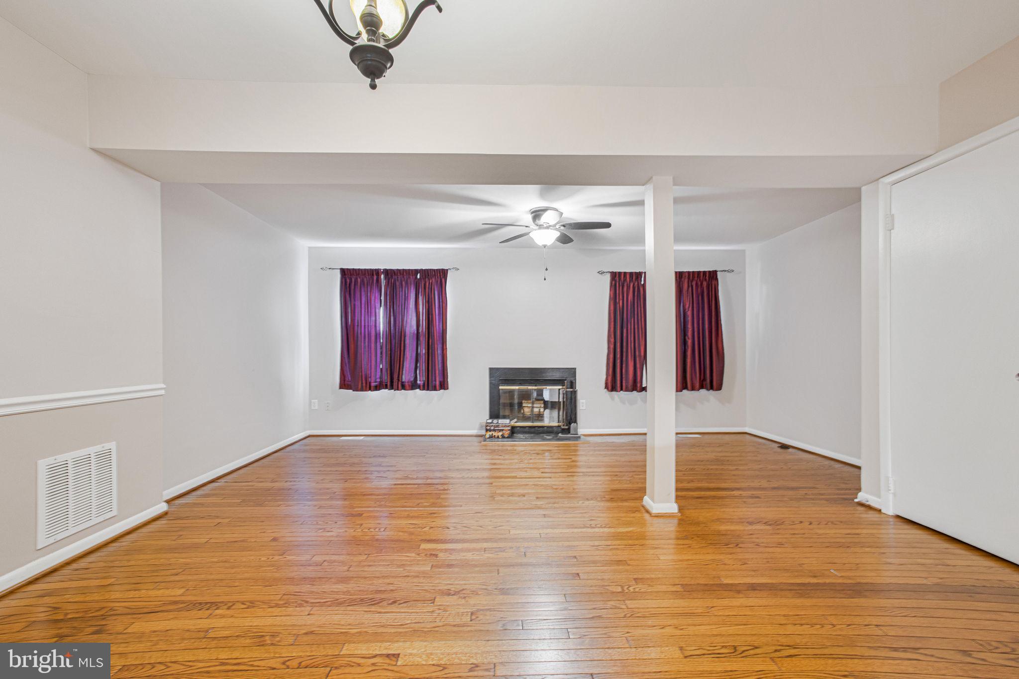 2830 Schoolhouse Circle Silver Spring, MD 20902 - Photo 6 of 58 a view of a livingroom with wooden floor and a chandelier