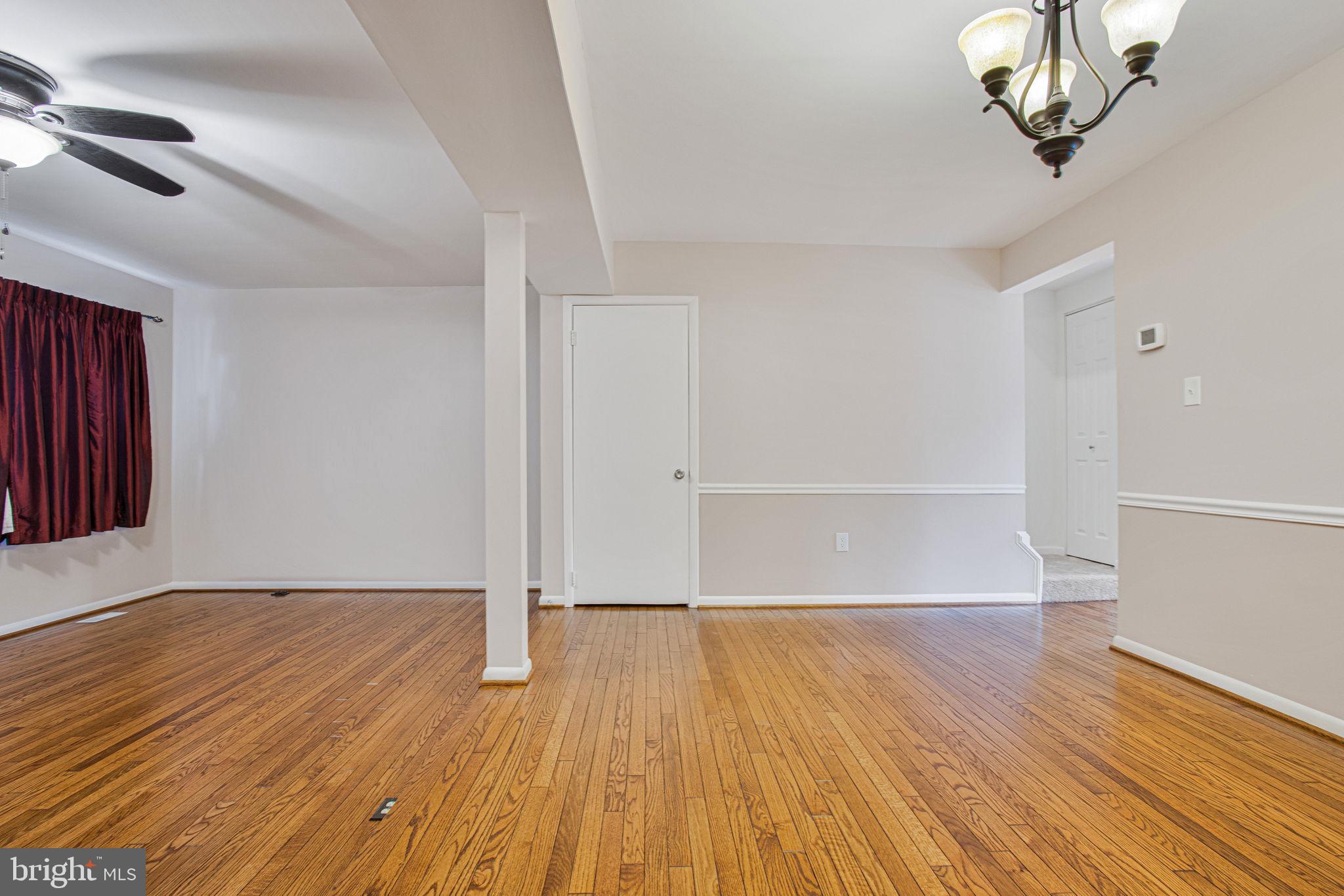 2830 Schoolhouse Circle Silver Spring, MD 20902 - Photo 8 of 58 wooden floor in an empty room with a window