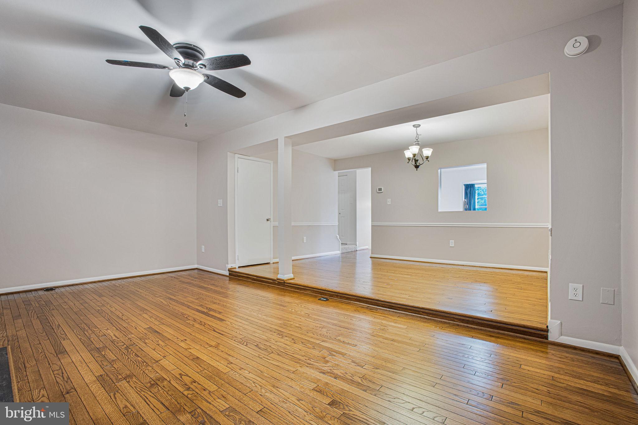 2830 Schoolhouse Circle Silver Spring, MD 20902 - Photo 10 of 58 wooden floor in an empty room with a window