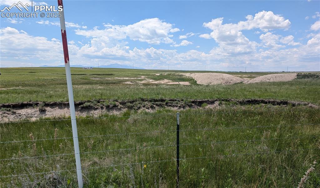 7995 Cowboy Rnch View Peyton, CO 80831 - Photo 21 of 24 a view of a lake from a yard