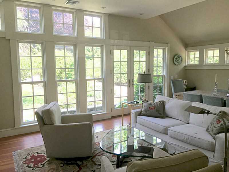 95 Longfellow Road Jamestown, RI 02835 - Photo 6 of 25 Living Room. This thoughtful addition, with gas fireplace, wall of windows, is 22 x 16.