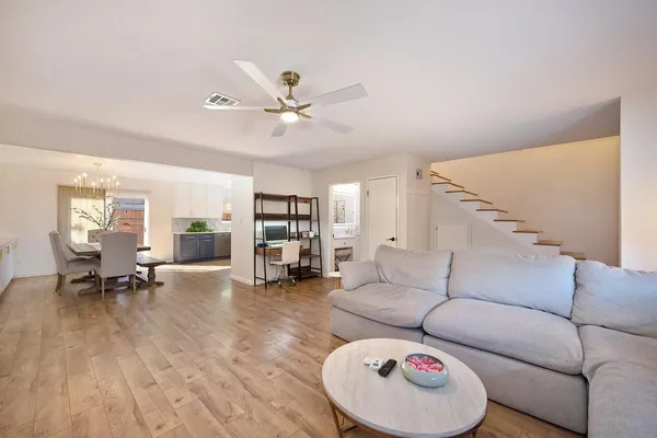 a living room with furniture and a rug
