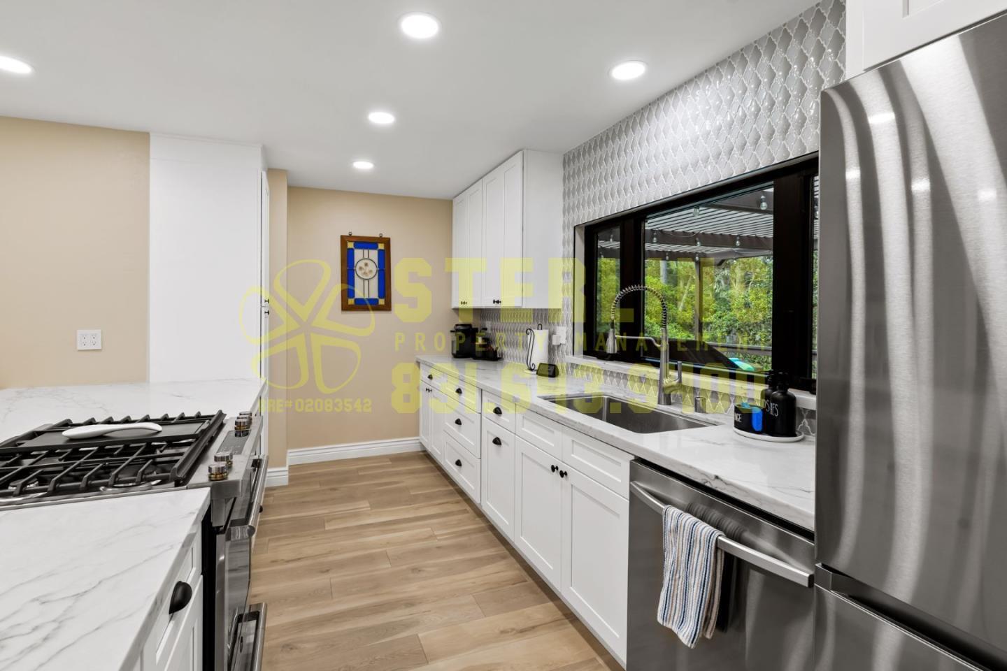 2040 Marsala Circle Monterey, CA 93940 - Photo 11 of 42 a kitchen with stainless steel appliances granite countertop a stove and a refrigerator