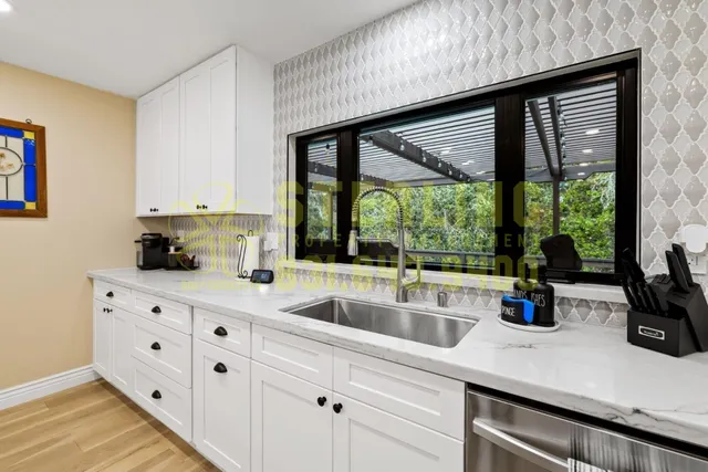 a kitchen sink with a garden space