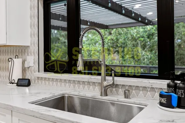 a kitchen with stove and sink