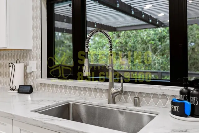 a kitchen with stove and sink