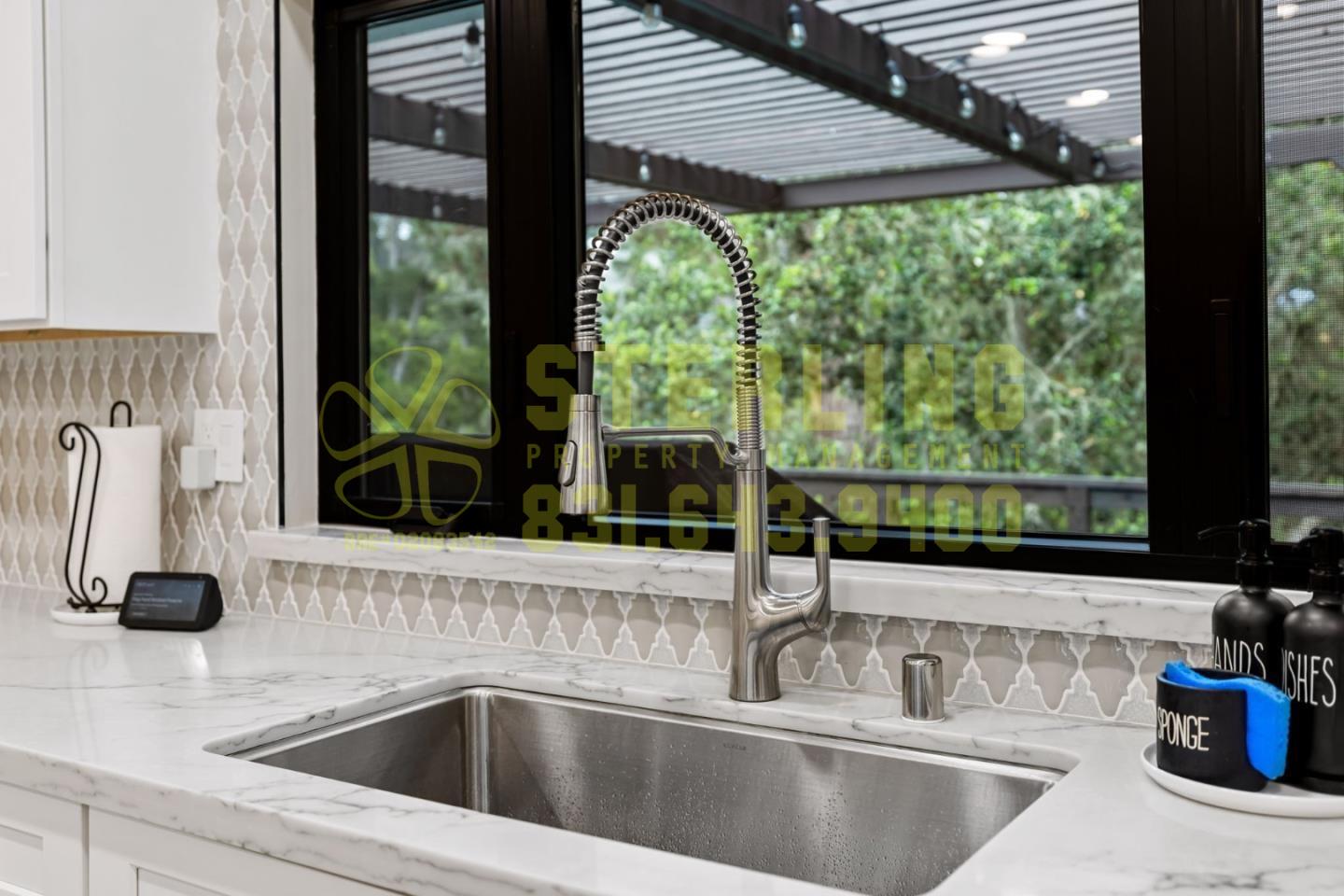 2040 Marsala Circle Monterey, CA 93940 - Photo 13 of 42 a kitchen sink with a garden space