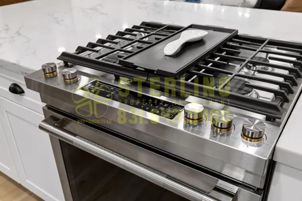 a kitchen with a refrigerator a sink and a stove