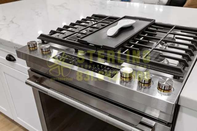 a kitchen with a refrigerator a sink and a stove