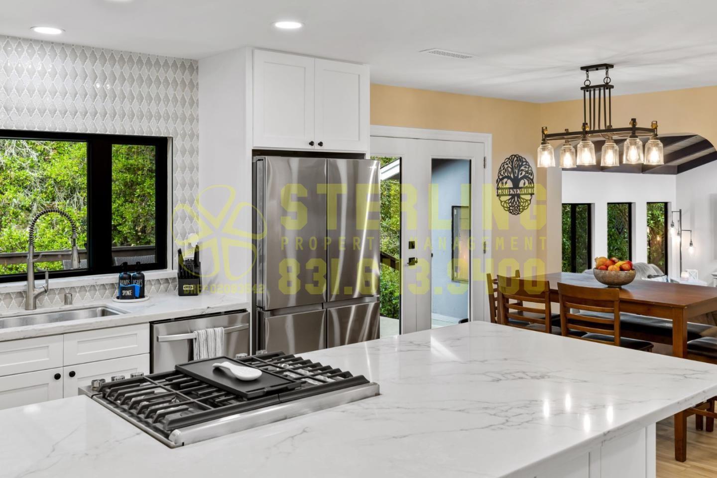 2040 Marsala Circle Monterey, CA 93940 - Photo 17 of 42 a kitchen with a refrigerator a sink and a stove