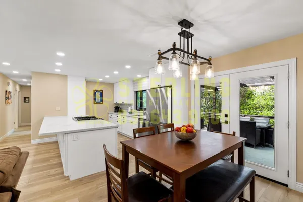a view of a dining room with furniture window and outside view
