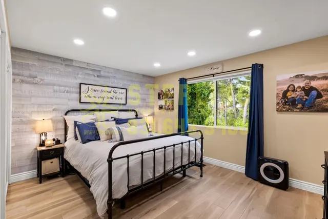 a bedroom with a bed and a view of bedroom