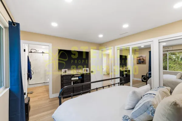 a bathroom with a double vanity sink toilet and shower