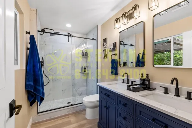 a bathroom with a double vanity sink and a mirror