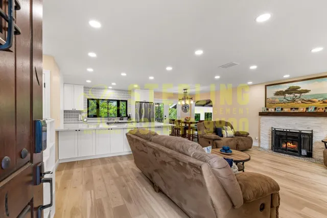 a living room with fireplace furniture and a fireplace