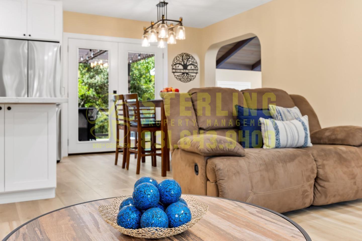 2040 Marsala Circle Monterey, CA 93940 - Photo 7 of 42 a living room with furniture and a chandelier
