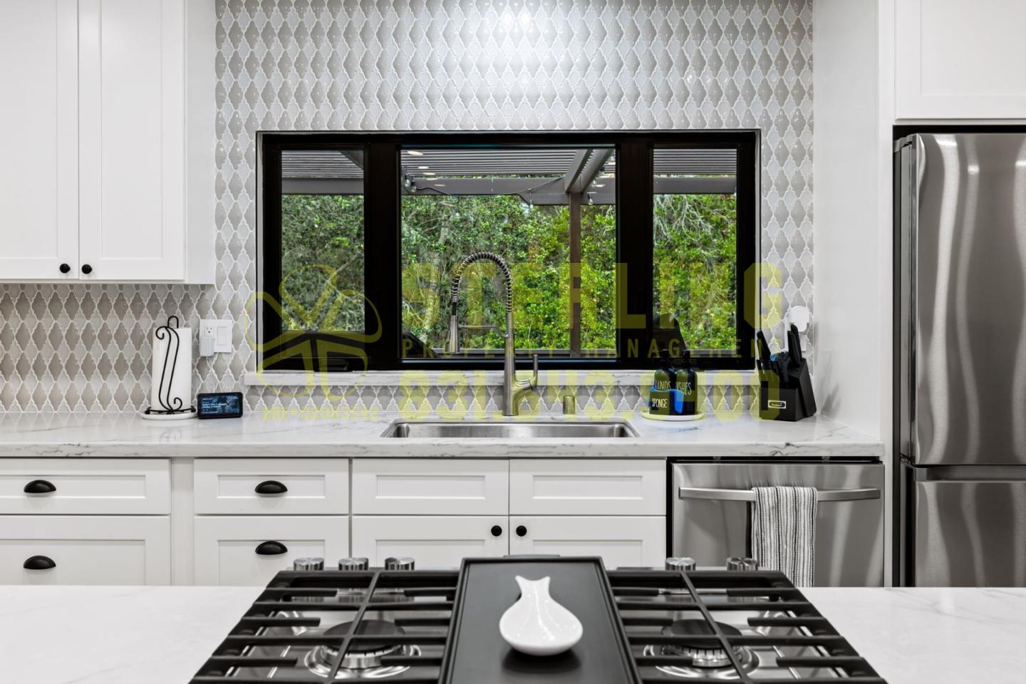2040 Marsala Circle Monterey, CA 93940 - Photo 10 of 42 a kitchen with a sink a stove and a refrigerator