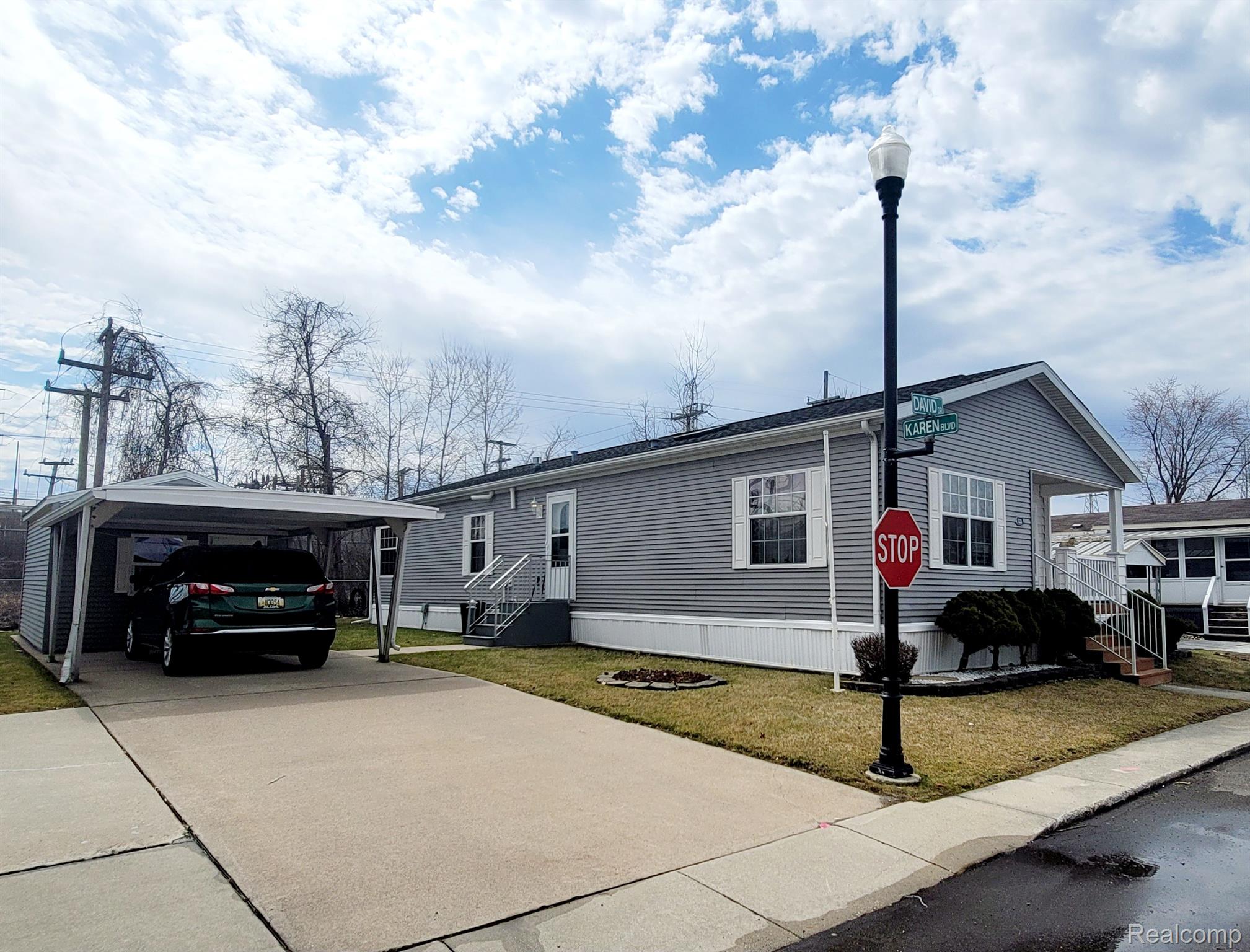 3333 Ravenswood Road Marysville, MI 48040 - Photo 2 of 21 2car parking with carport and shed