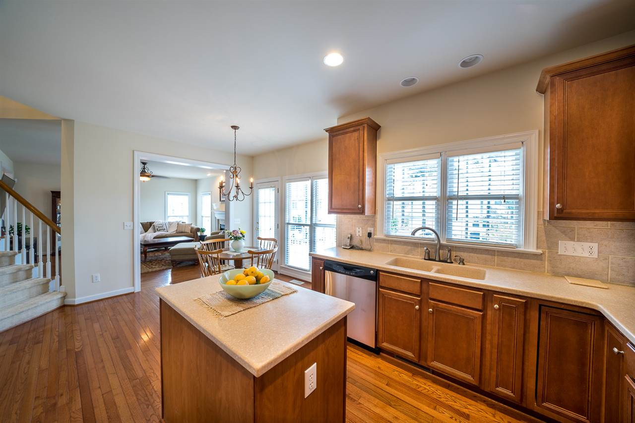 6033 Jones Farm Road Wake Forest, NC 27587 - Photo 16 of 30 Tons of counter space, nice tile backsplash, ss appliances and island! Kitchen
