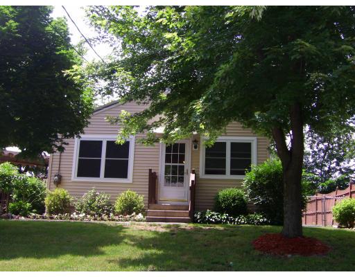 72 Gilbert Avenue Springfield, MA 01119 - Photo 1 of 16 a front view of a house with a yard and outdoor seating