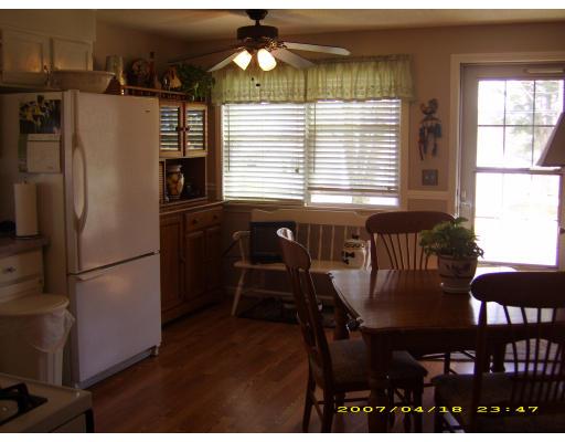72 Gilbert Avenue Springfield, MA 01119 - Photo 5 of 16 a kitchen with a table chairs and refrigerator