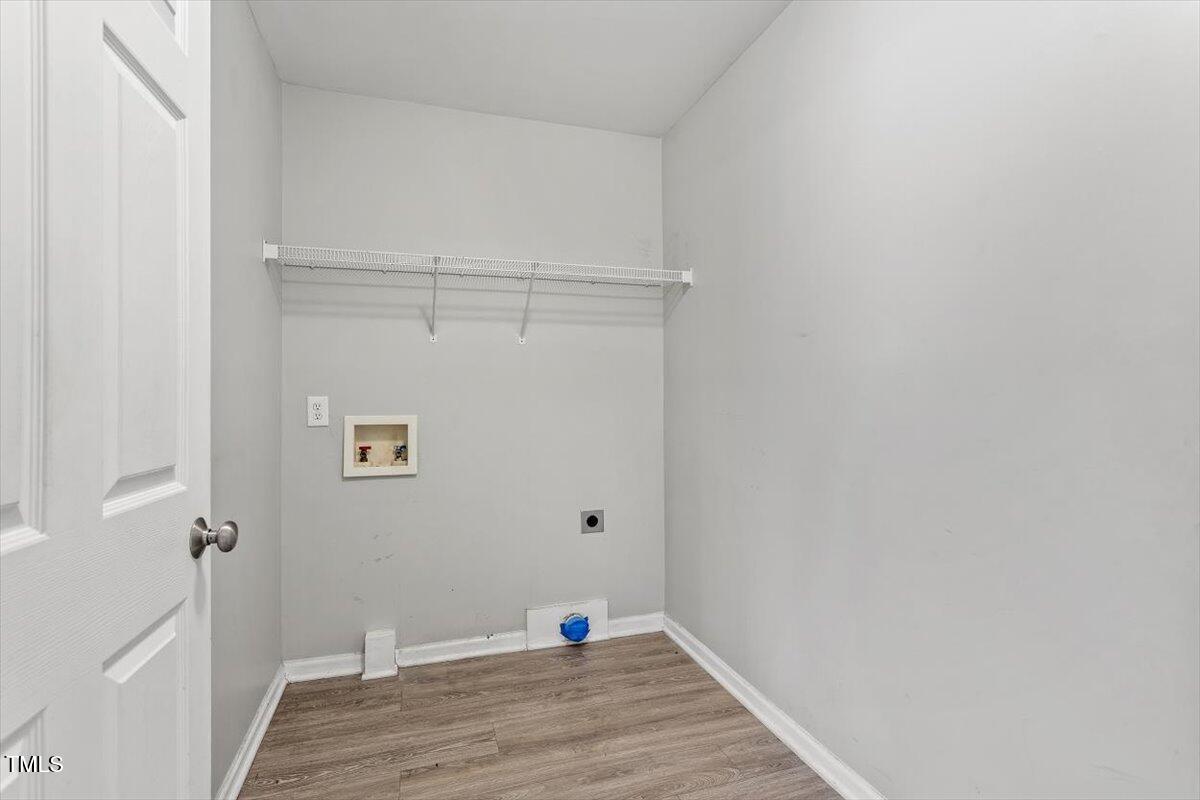 212 Webfoot Drive Garner, NC 27529 - Photo 14 of 26 a view of a room with wooden floor