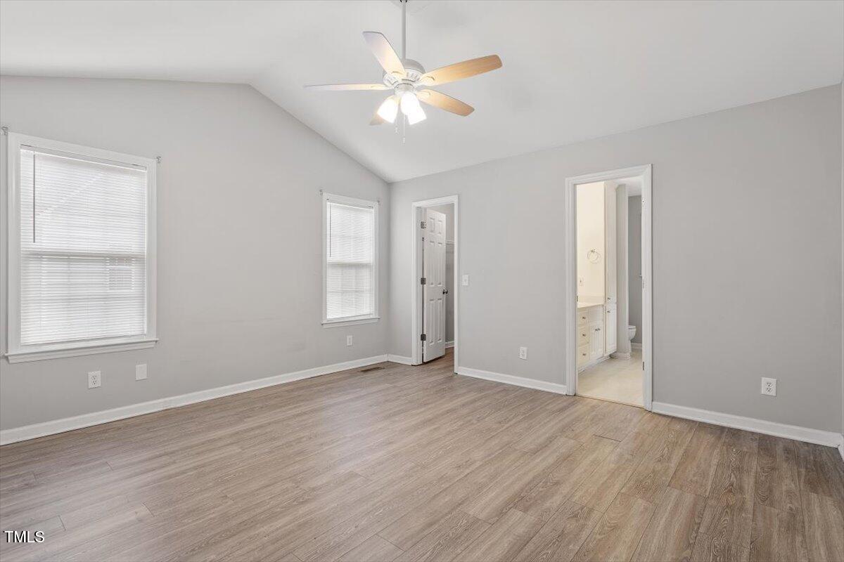 212 Webfoot Drive Garner, NC 27529 - Photo 15 of 26 an empty room with wooden floor and window