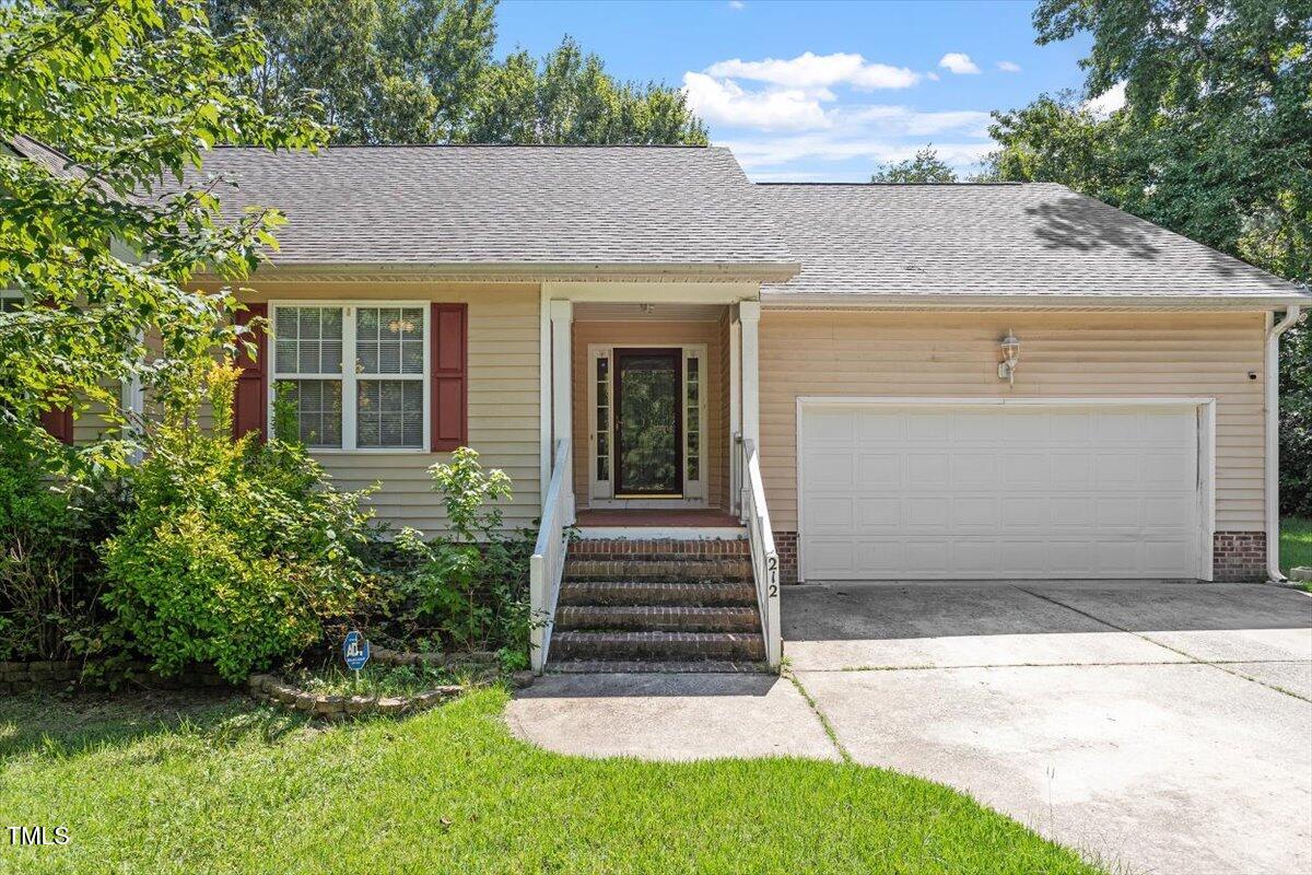 212 Webfoot Drive Garner, NC 27529 - Photo 2 of 26 a front view of a house with a yard