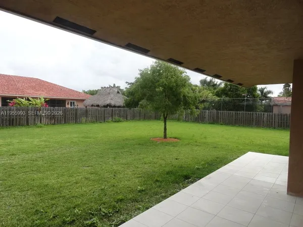 a backyard of a house with lots of green space