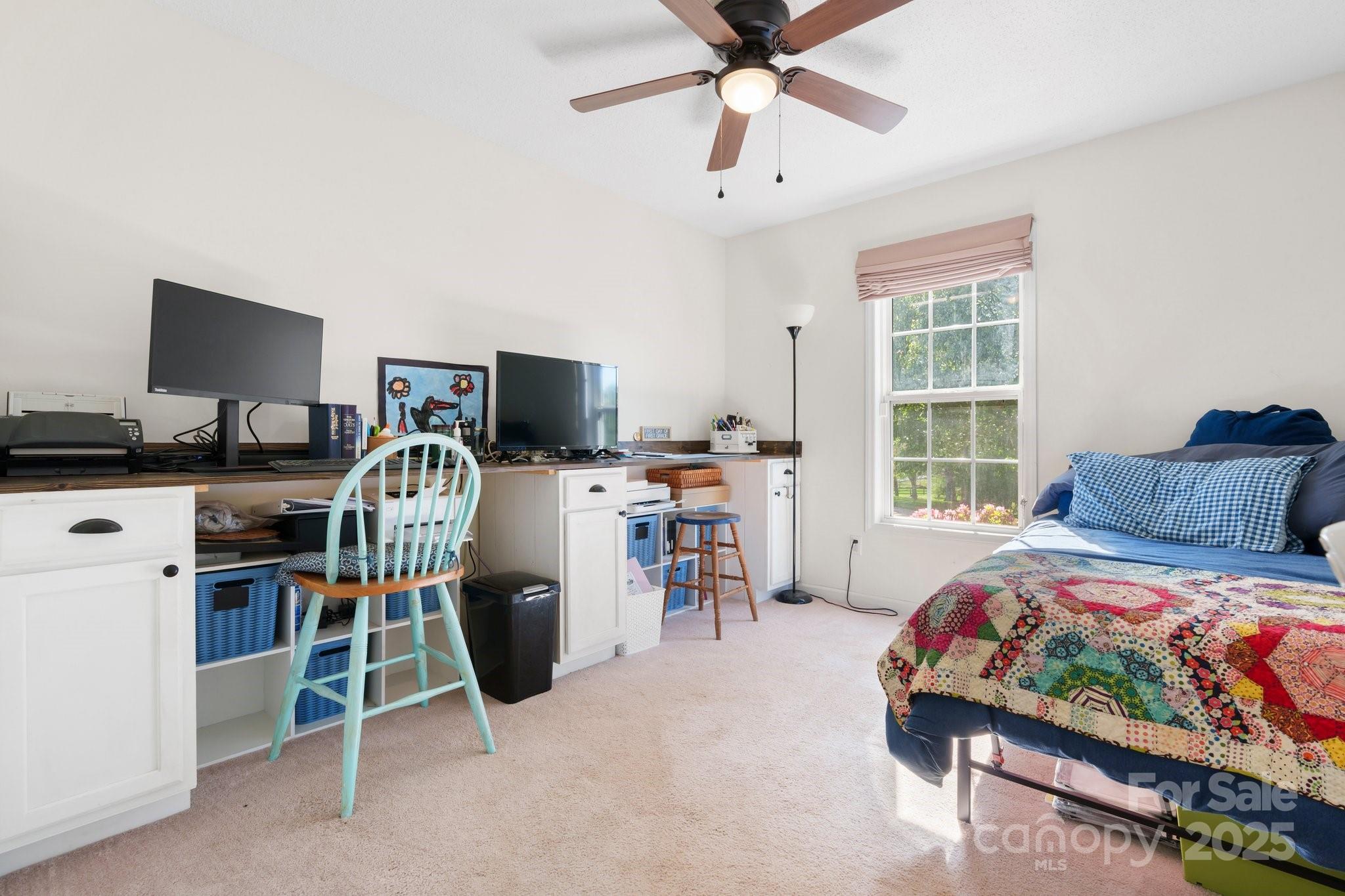 5184 Swinging Bridge Road Conover, NC 28613 - Photo 16 of 38 a bedroom with a bed a desk and chair