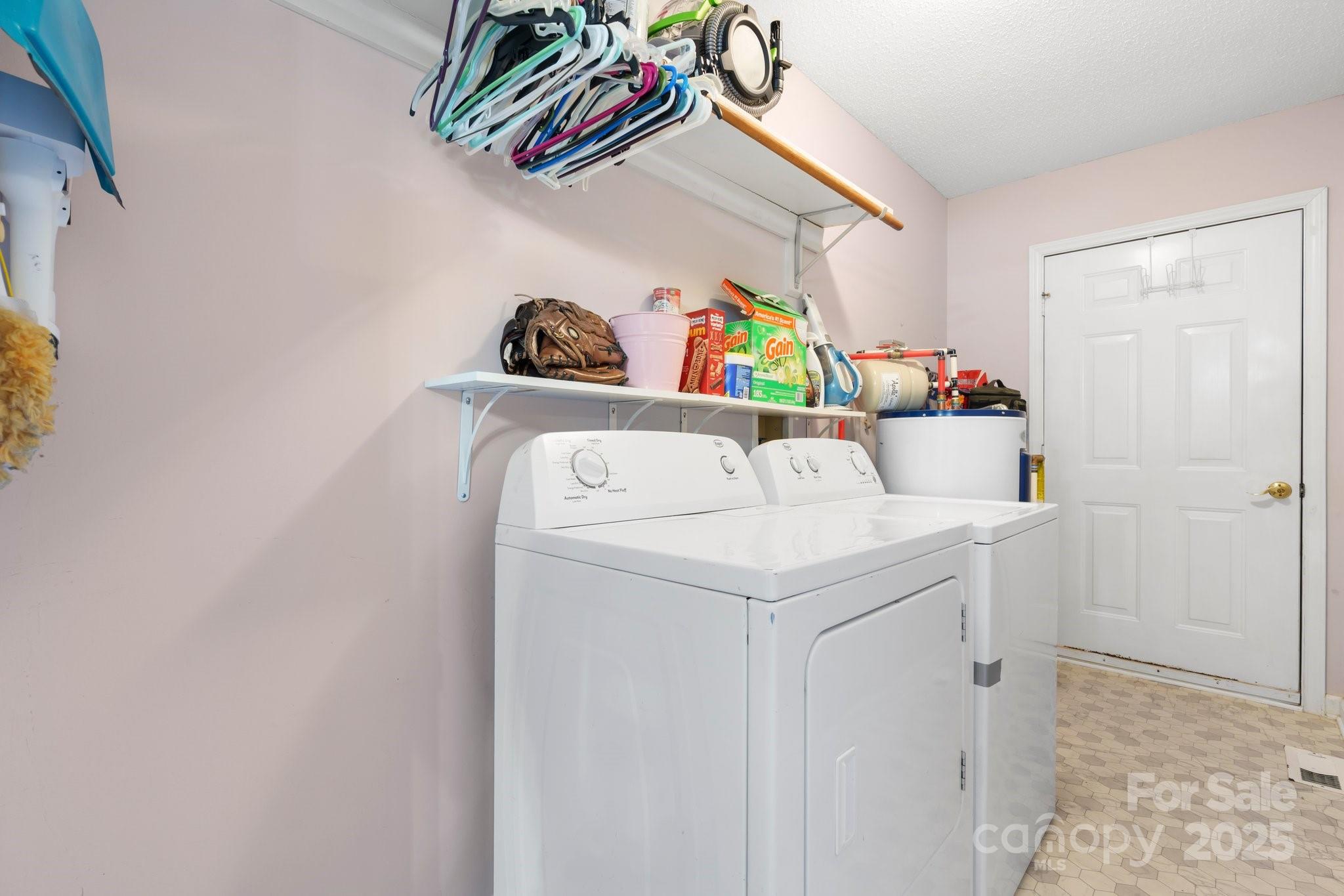 5184 Swinging Bridge Road Conover, NC 28613 - Photo 20 of 38 a utility room with dryer and washer