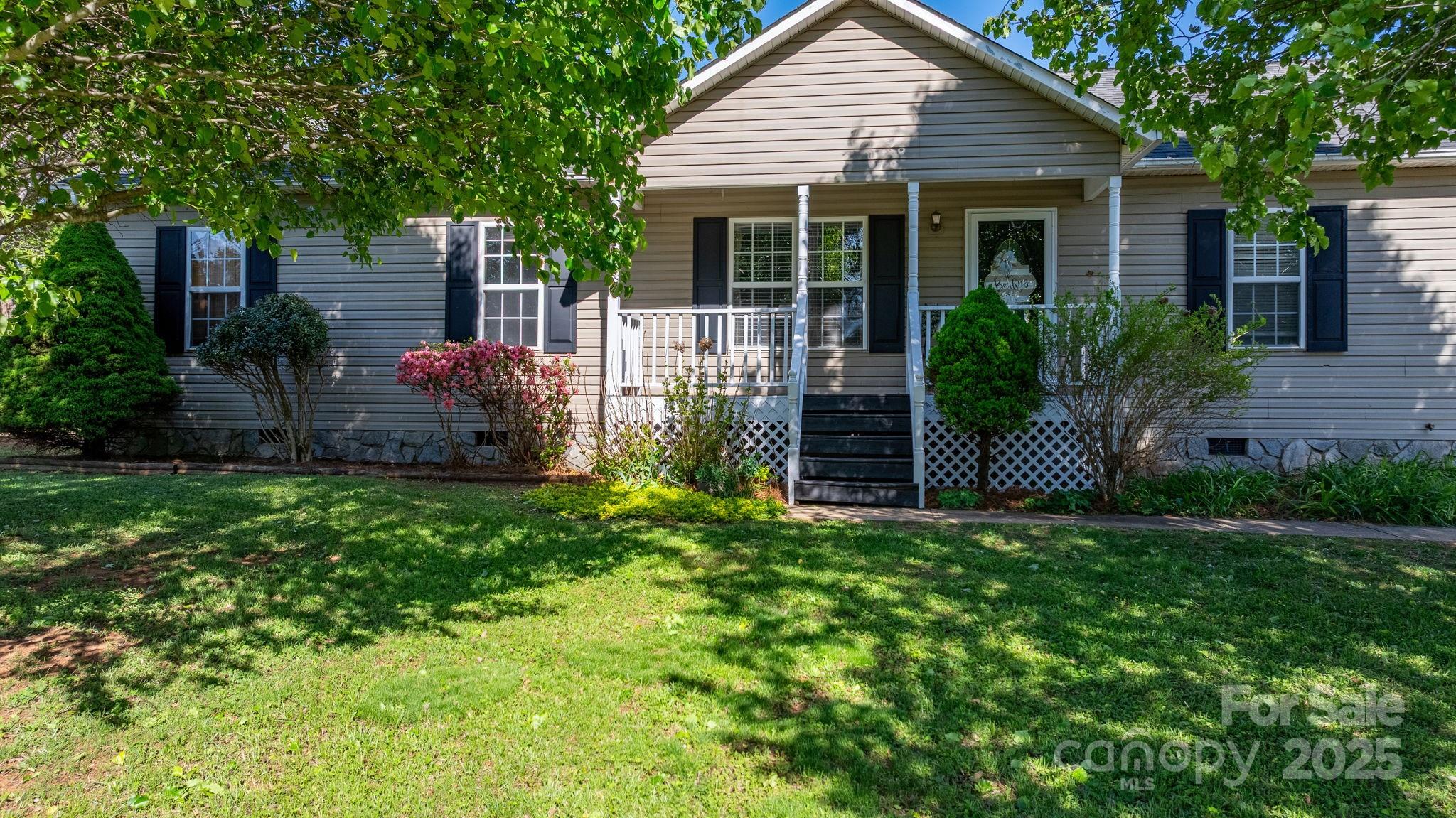 5184 Swinging Bridge Road Conover, NC 28613 - Photo 2 of 38 a view of a house with brick walls and a yard with plants