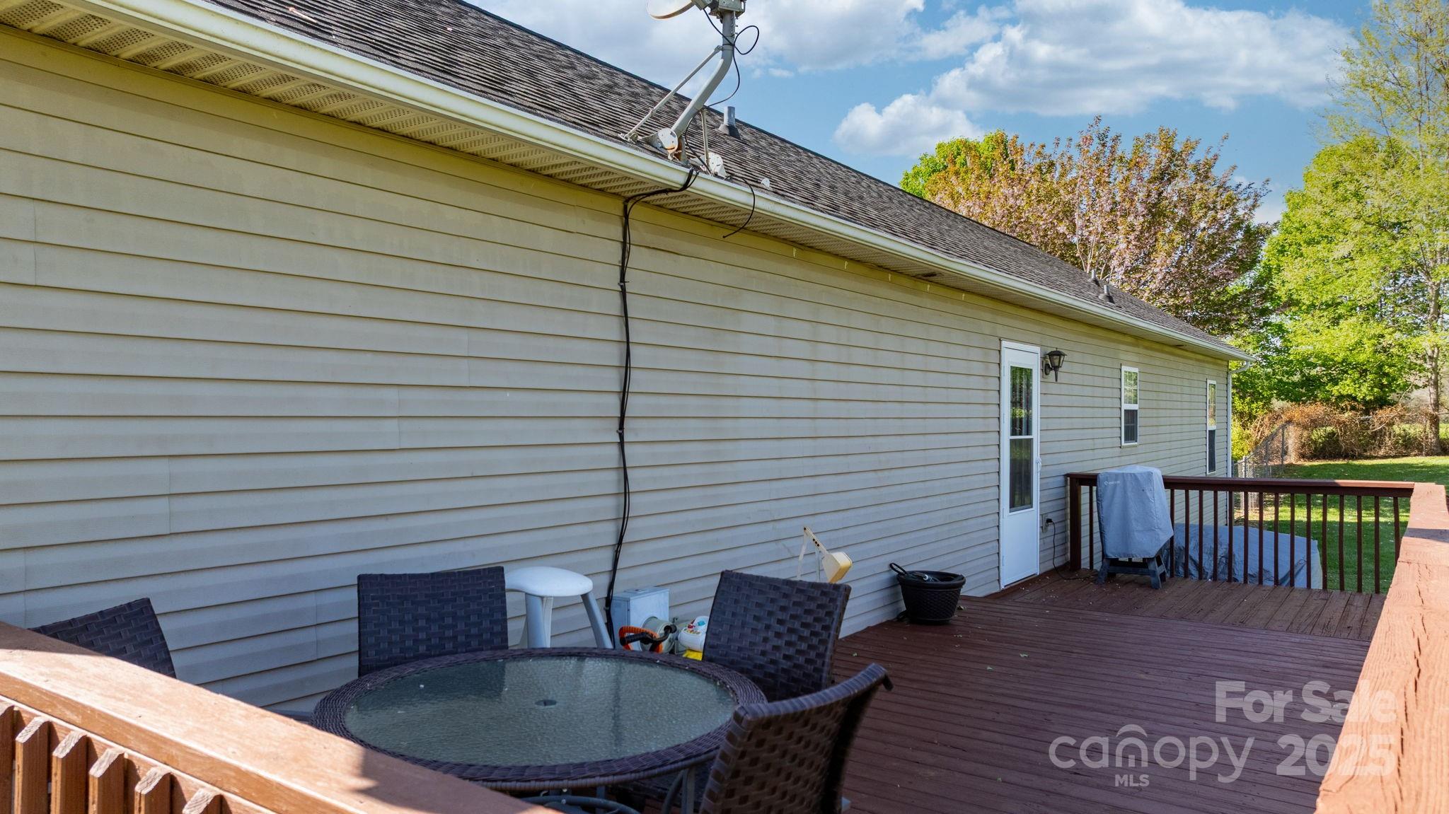 5184 Swinging Bridge Road Conover, NC 28613 - Photo 22 of 38 a backyard of a house with table and chairs