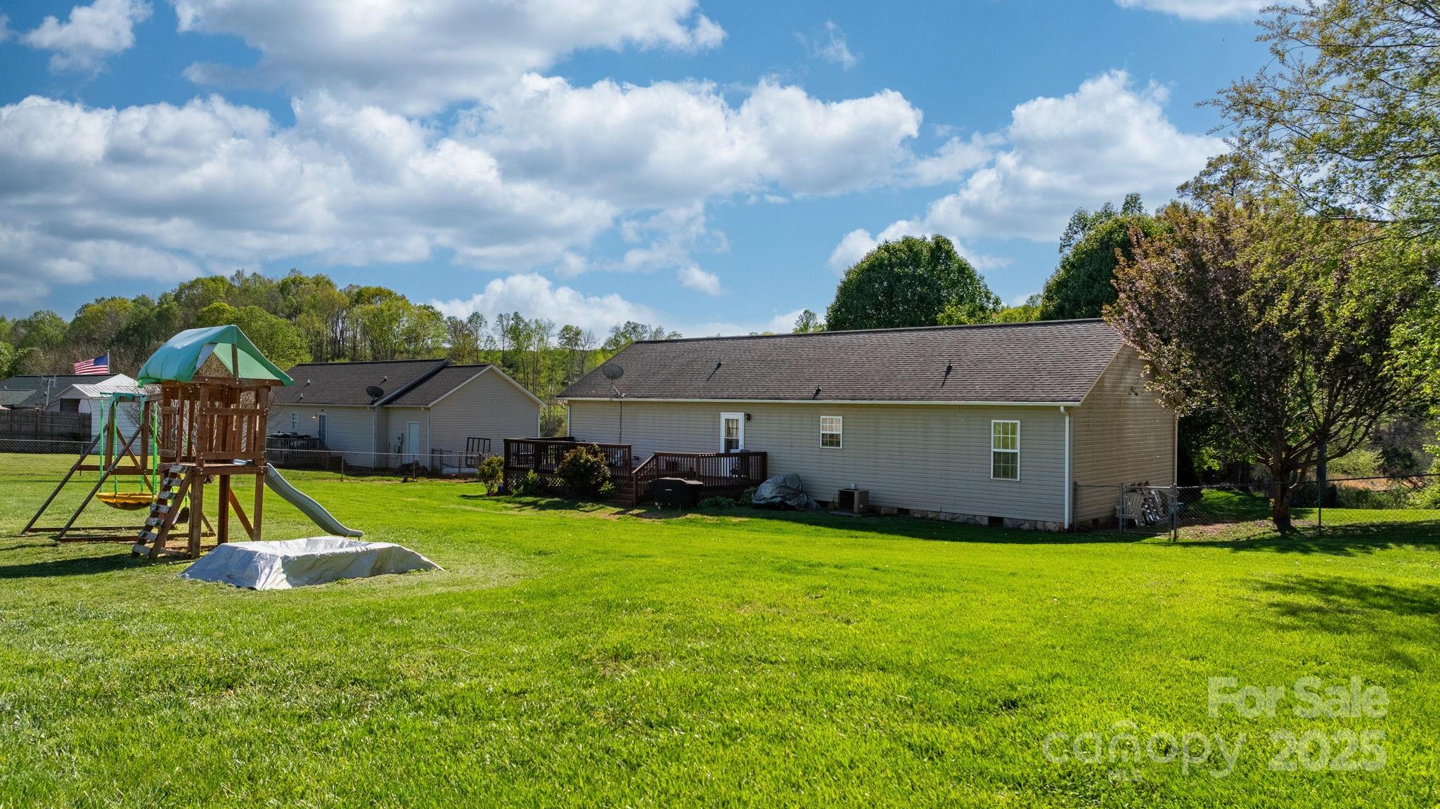 5184 Swinging Bridge Road Conover, NC 28613 - Photo 25 of 38 a view of a house with a yard and sitting area