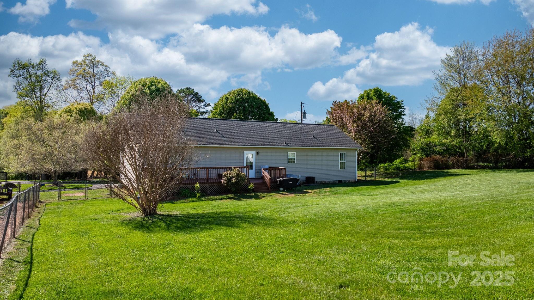 5184 Swinging Bridge Road Conover, NC 28613 - Photo 26 of 38 a view of a house with a big yard and large trees