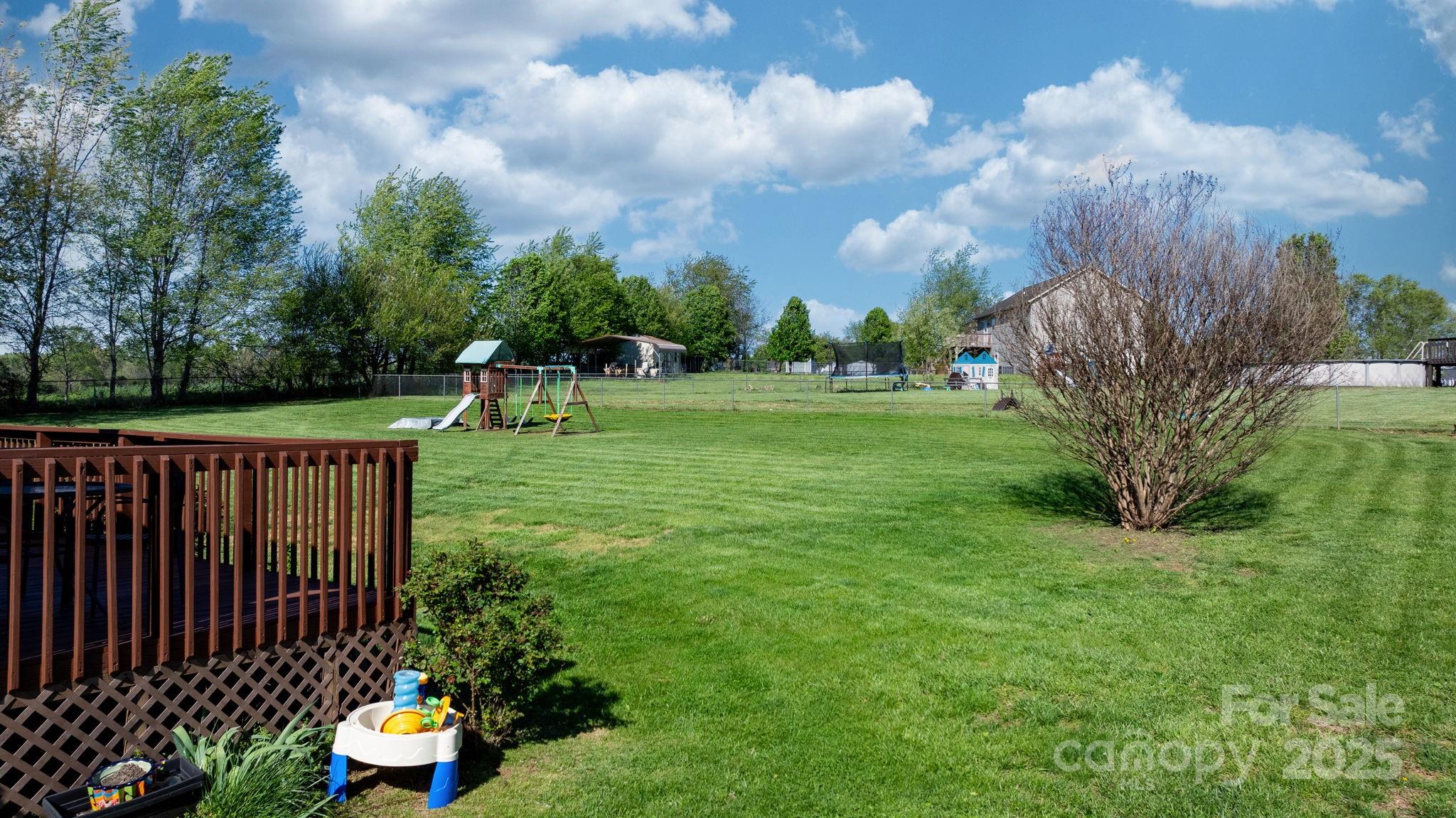 5184 Swinging Bridge Road Conover, NC 28613 - Photo 27 of 38 a childrens park with lots of green space and plants
