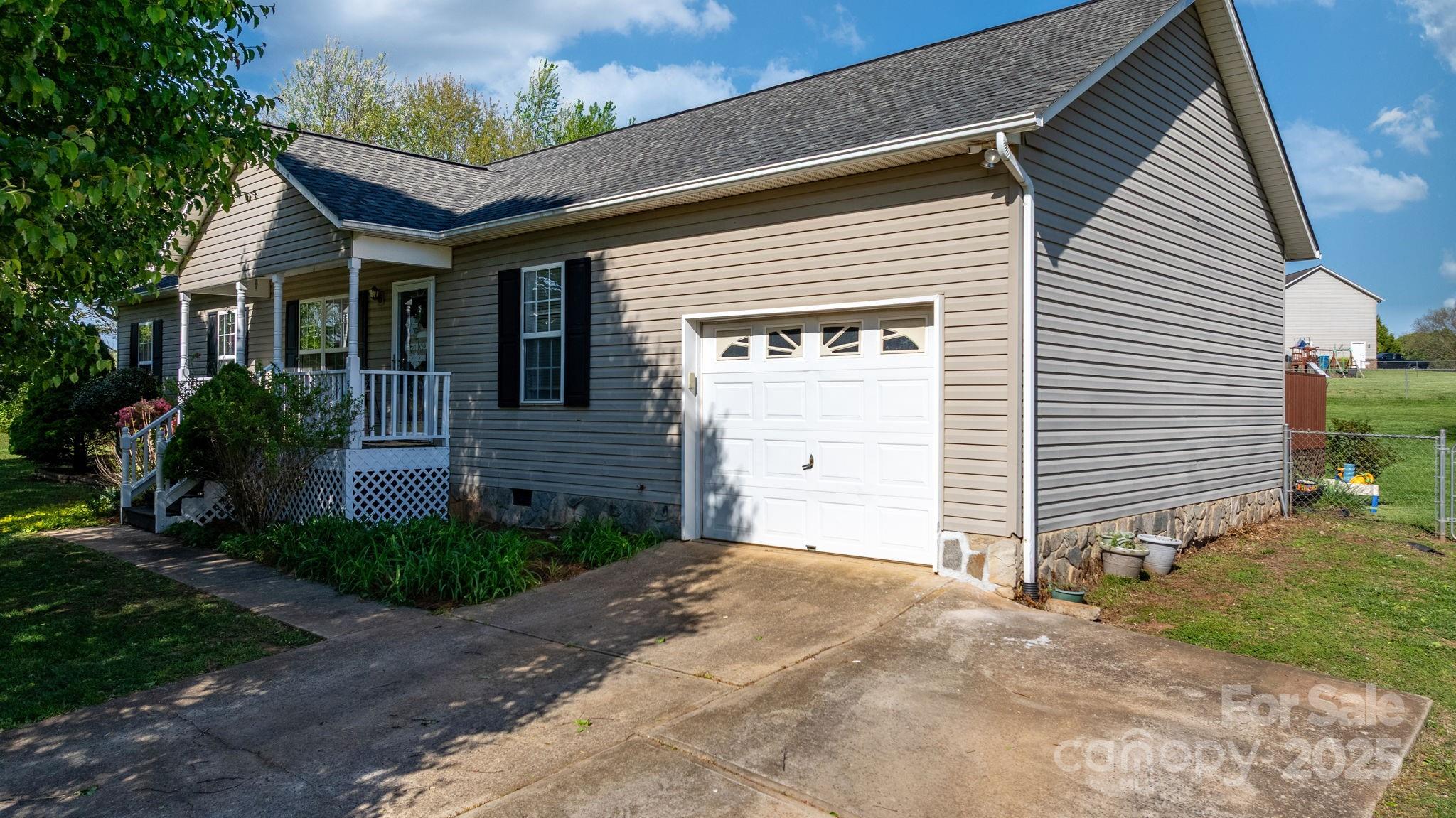 5184 Swinging Bridge Road Conover, NC 28613 - Photo 29 of 38 a front view of a house with a yard