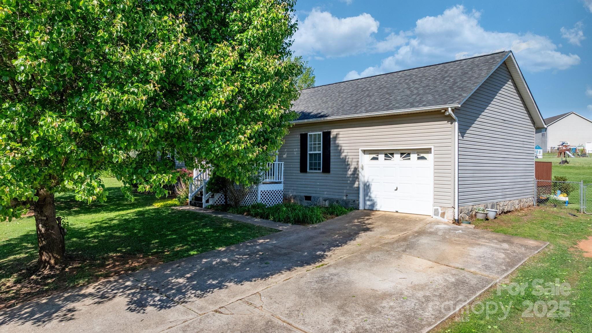 5184 Swinging Bridge Road Conover, NC 28613 - Photo 34 of 38 a front view of a house with a yard
