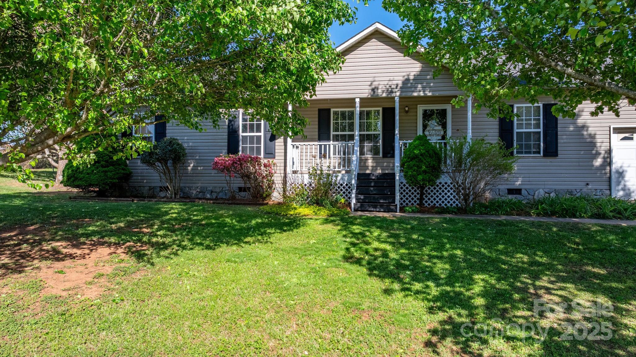 5184 Swinging Bridge Road Conover, NC 28613 - Photo 35 of 38 a front view of house with a garden