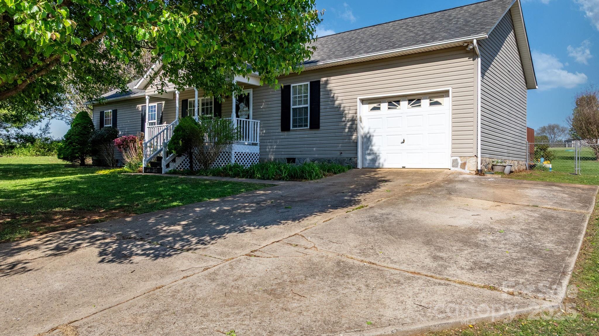 5184 Swinging Bridge Road Conover, NC 28613 - Photo 36 of 38 a view of a house with a yard