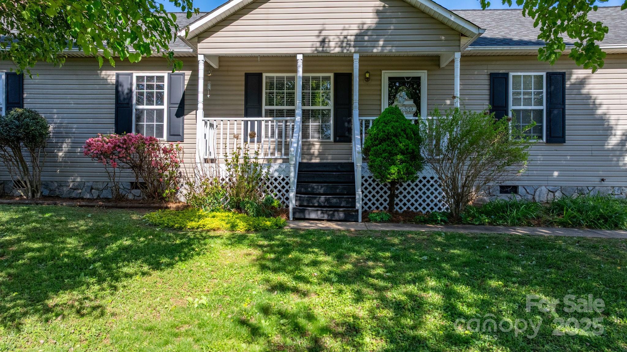 5184 Swinging Bridge Road Conover, NC 28613 - Photo 37 of 38 a view of a house with a yard and plants