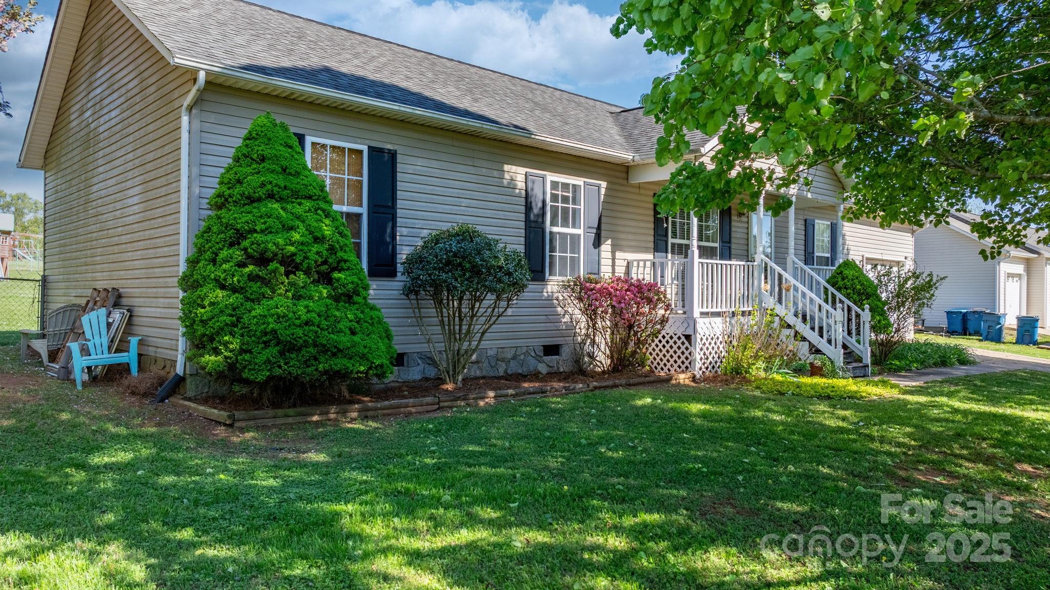5184 Swinging Bridge Road Conover, NC 28613 - Photo 38 of 38 a front view of a house with garden
