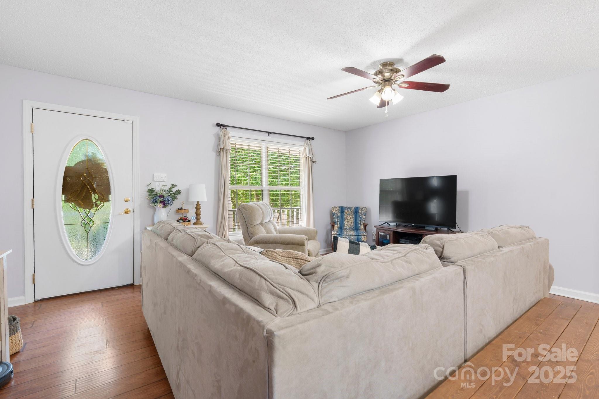 5184 Swinging Bridge Road Conover, NC 28613 - Photo 4 of 38 a living room with furniture and a flat screen tv
