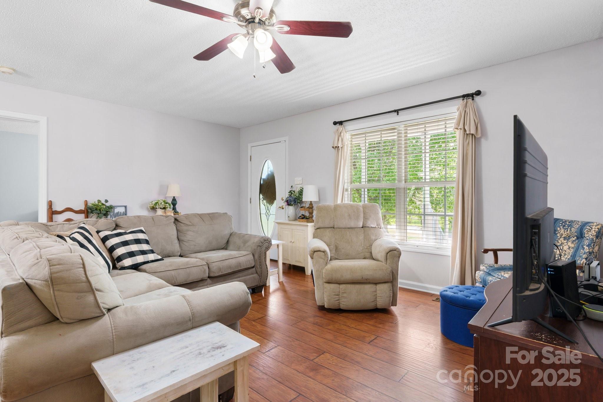 5184 Swinging Bridge Road Conover, NC 28613 - Photo 6 of 38 a living room with furniture or couch and a large window